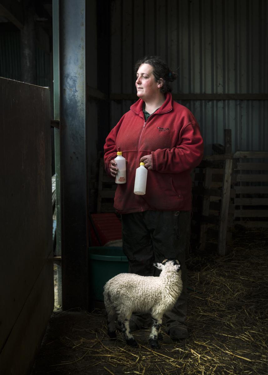 Shepherdess with lamb